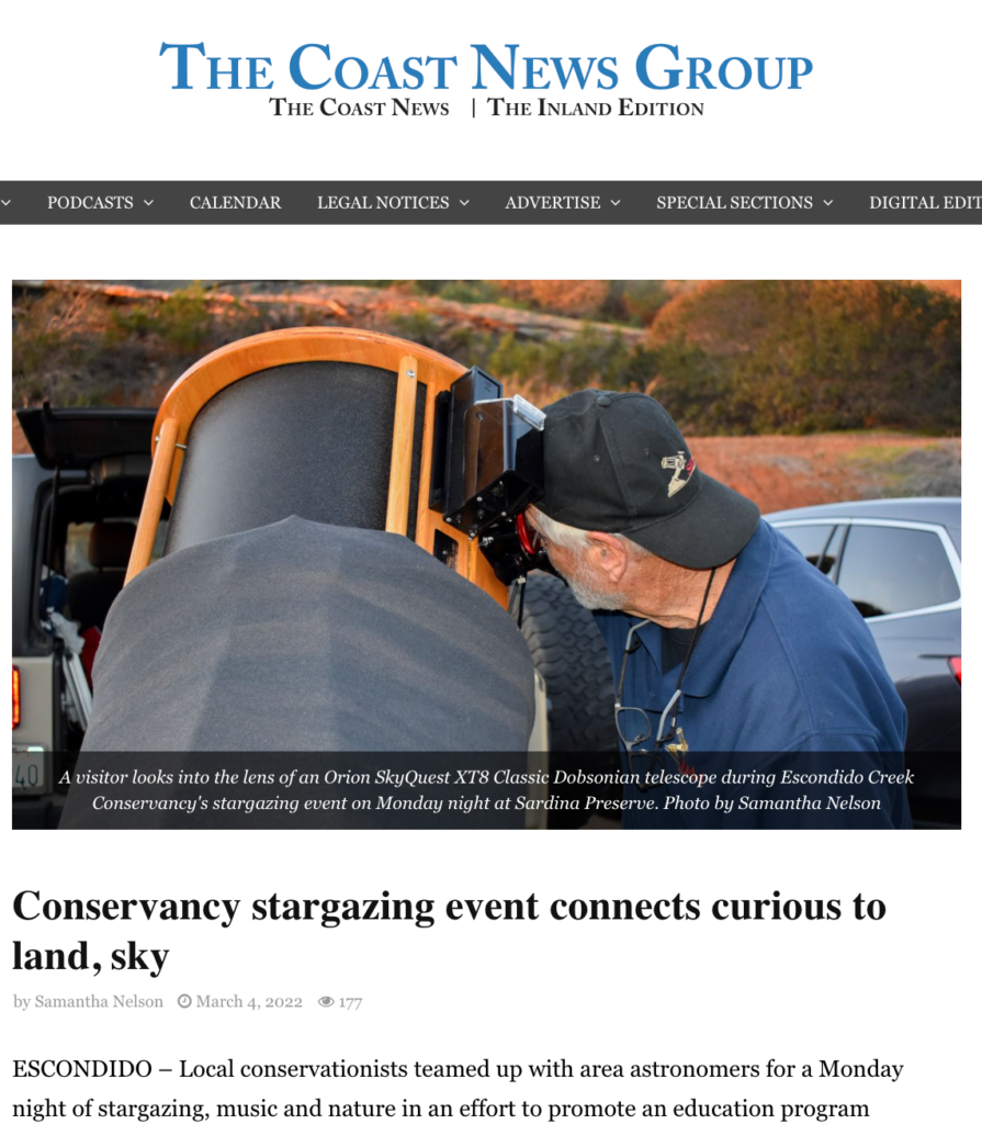 The headline and cover photo of a man looking into a huge telescope from the Coast News Group